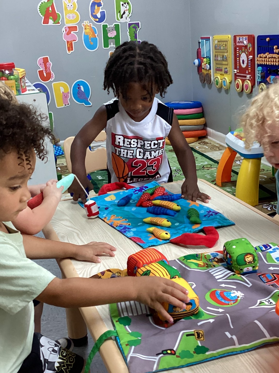 Young World children engaged in a hands-on learning activity